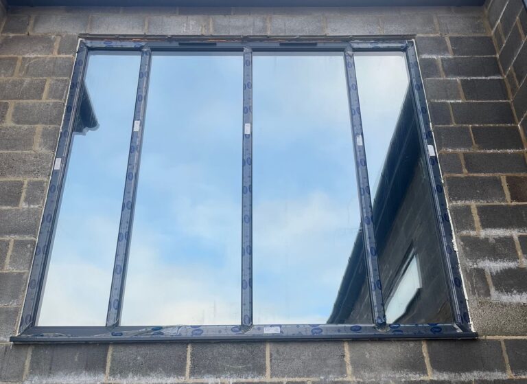 Installing Dark Sputtered Neutral 25 Film for Property Privacy