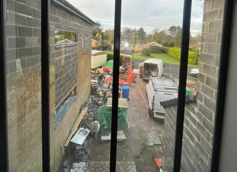 Installing Dark Sputtered Neutral 25 Film for Property Privacy