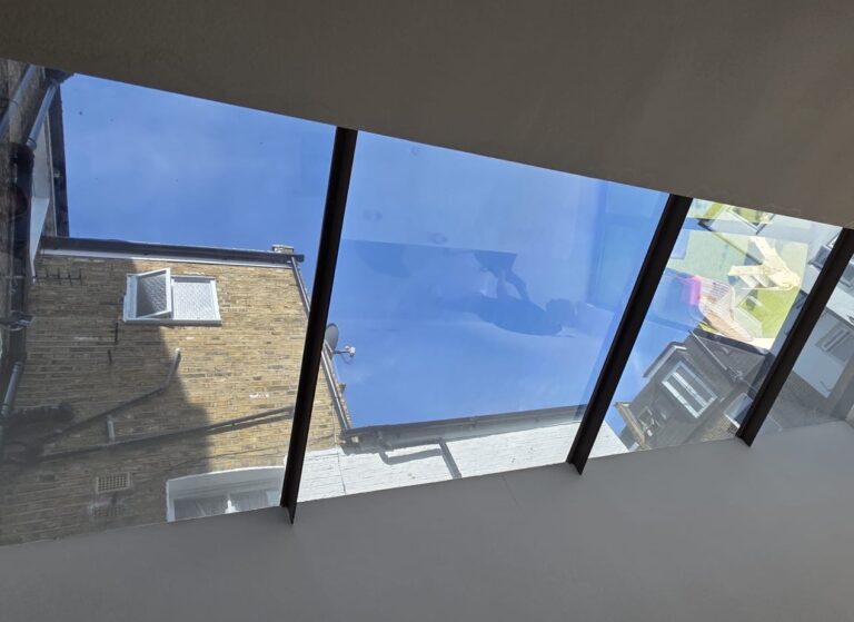 Installation of Dark Reflective Silver 20 Window on Residential Skylights